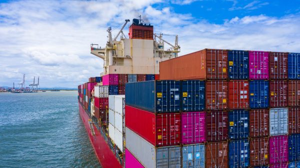 Container ship carrying container for business freight import and export, Aerial view container ship arriving in commercial port.